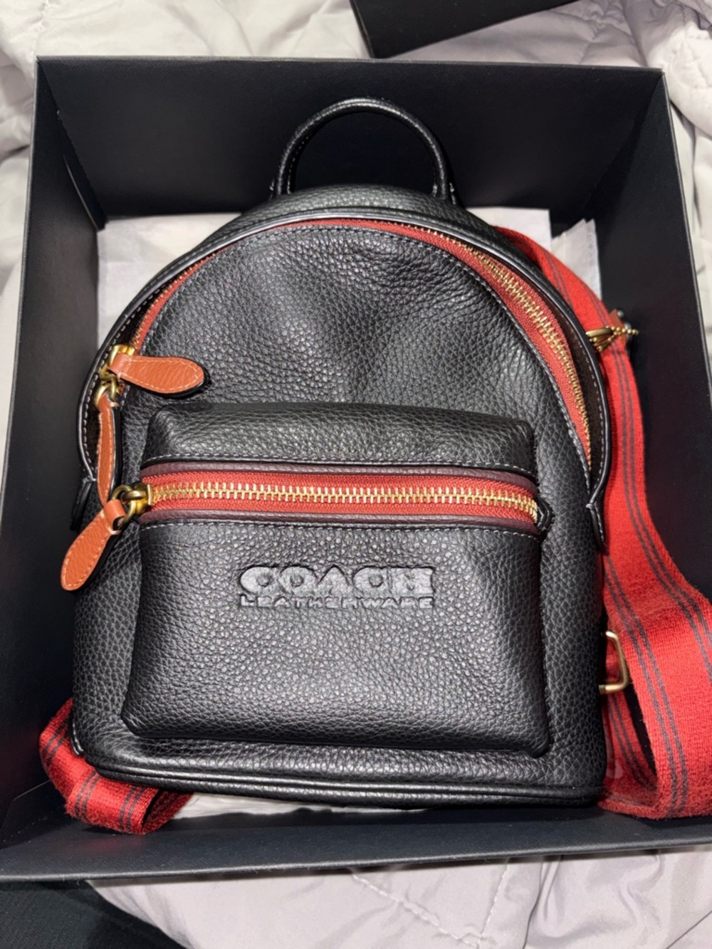Coach Black Pebbled Leather Mini Backpack with Red Strap and Tan Accents